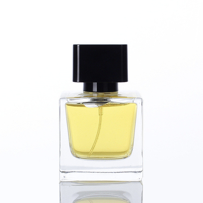 El Subpackage transparente de la botella de vidrio del perfume del cuadrado al por mayor de 30ml 50ml 100ml rocía la botella de perfume vacía con la tapa