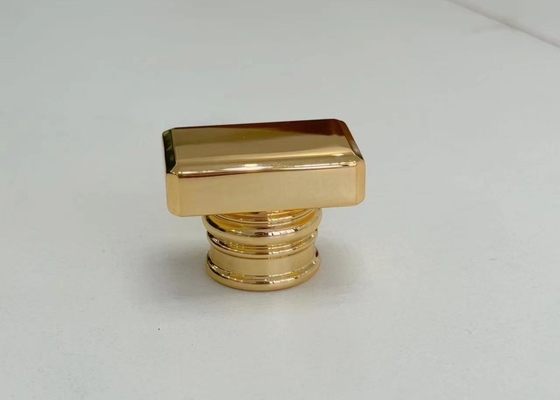 Capa de perfume Zamak de oro en forma de T de aleación de zinc para embalajes de fragancias personalizados
